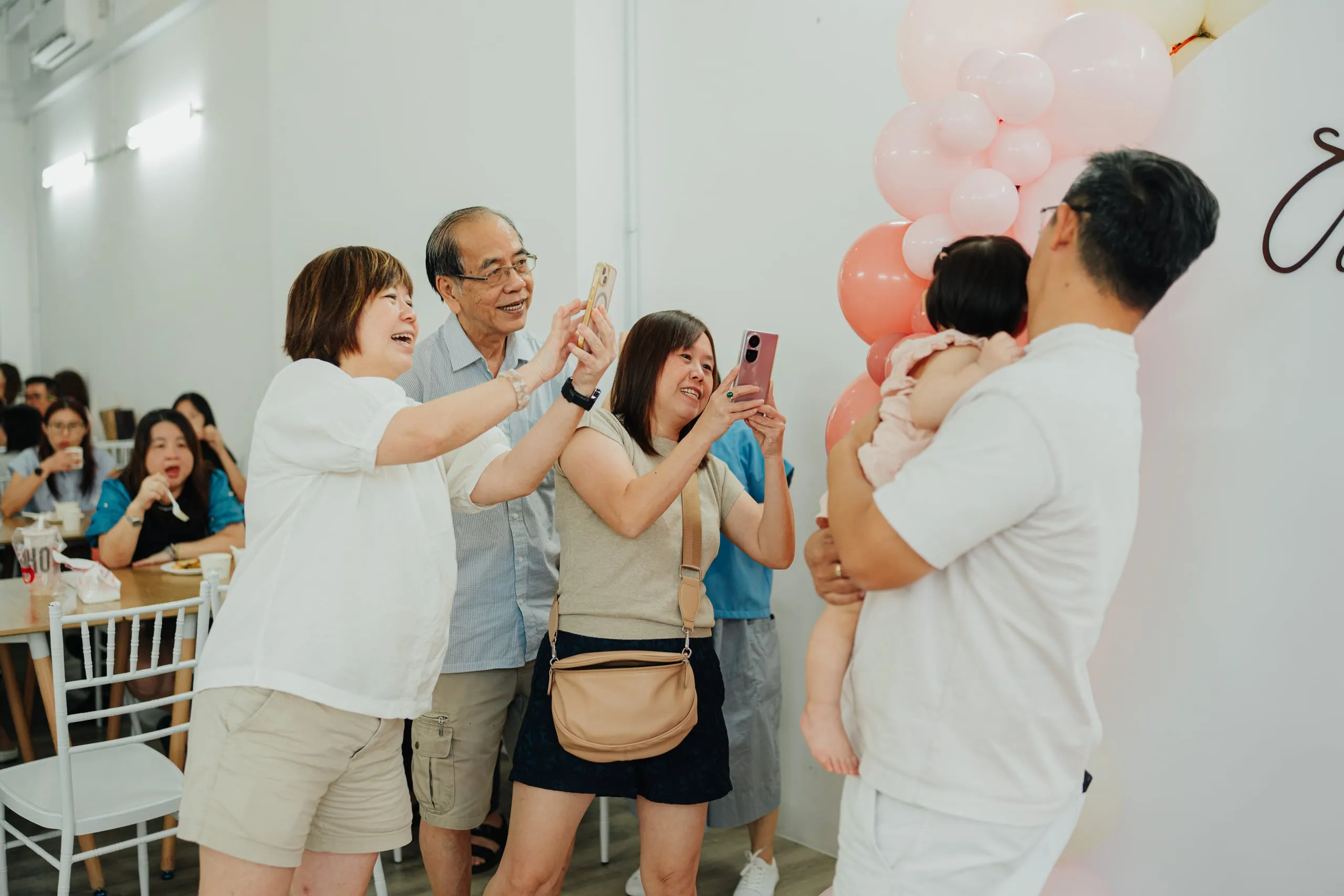 guests at a baby 100 days celebration at The Happi Loft